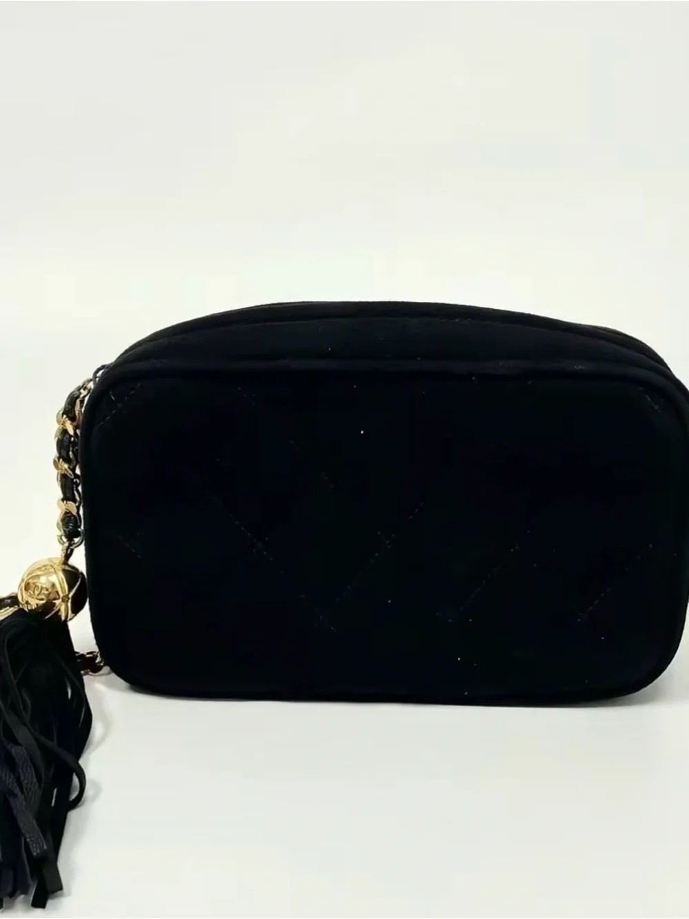 CHANEL Black Quilted Crossbody Bag with Gold Chain and Tassel